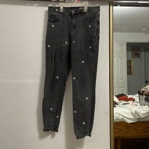 Black embroidered daisy jeans